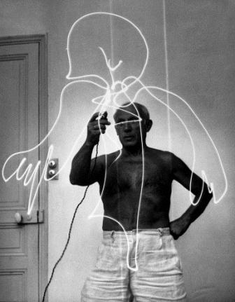 Artist Pablo Picasso using flashlight to make light drawing in the air.  (Photo by Gjon Mili//Time Life Pictures/Getty Images)